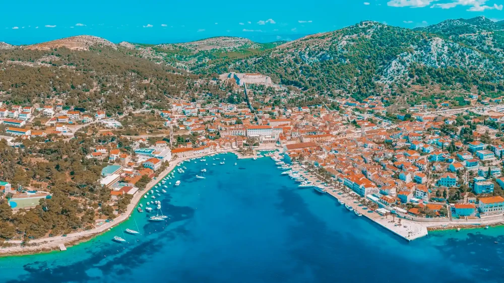 Yachts and boats Docked on Hvar island and crystal clear sea